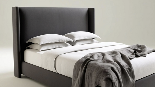 black fabric king size bed with winged headboard