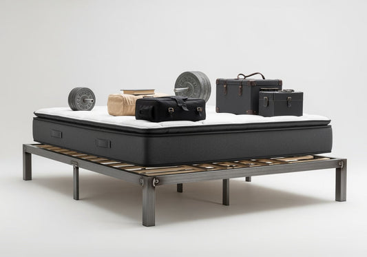 a king size bed frame and mattress with weights on