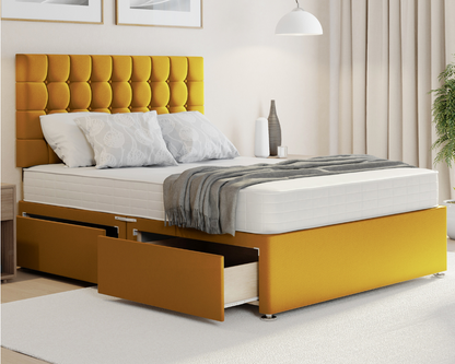 mustard plush cubex style divan bed with mattress and storage drawers.